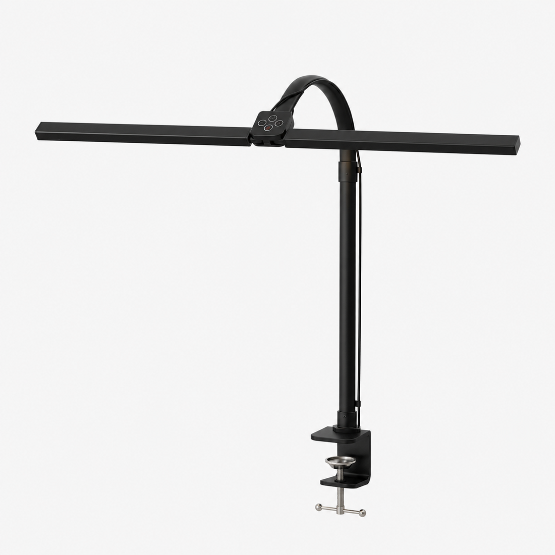 Arc clamp desk lamp lighting a workspace at night